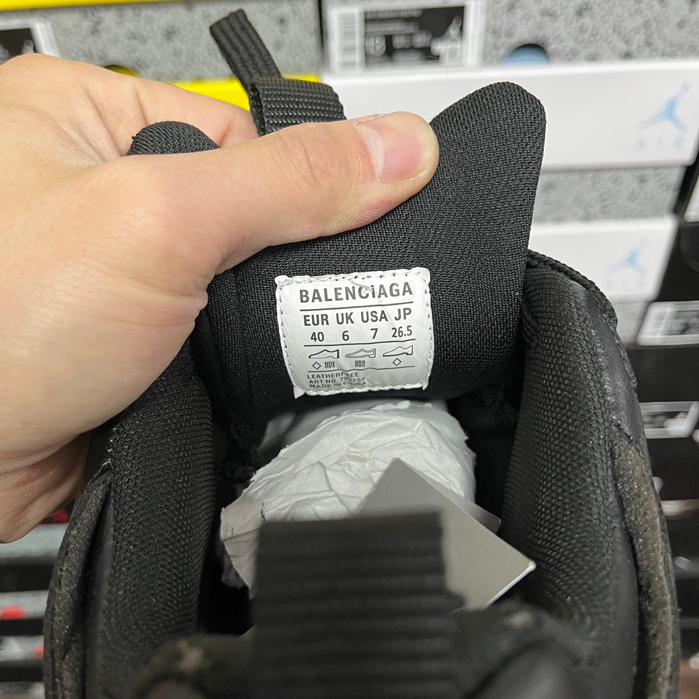 Black sneakers size label area with BALENCIAGA tag and numeric sizing details