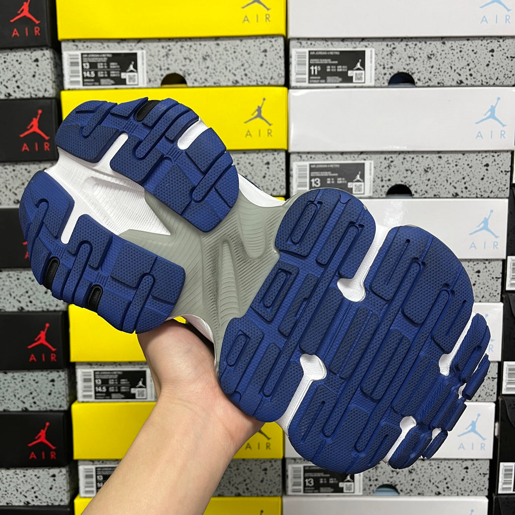 Blue and white sneaker outsoles with molded tread grips
