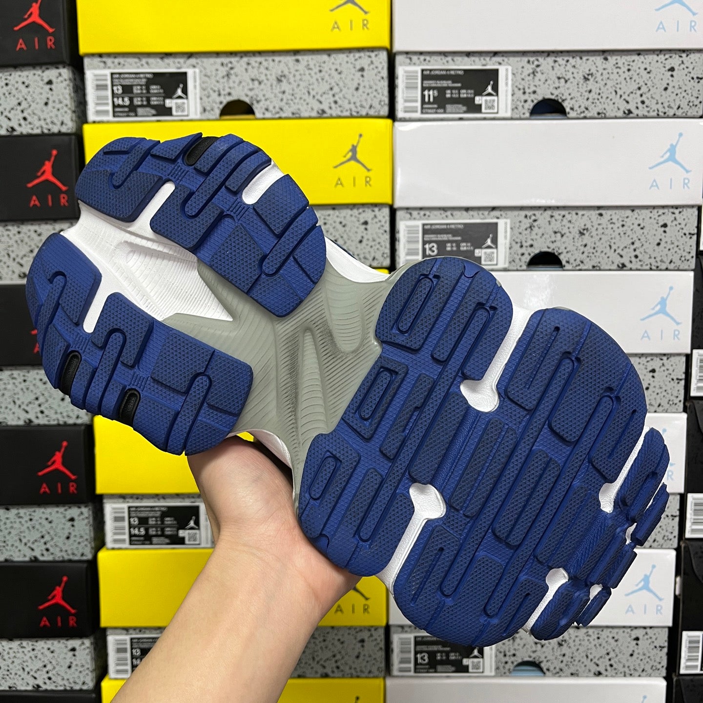 Blue and white sneaker outsoles with molded tread grips