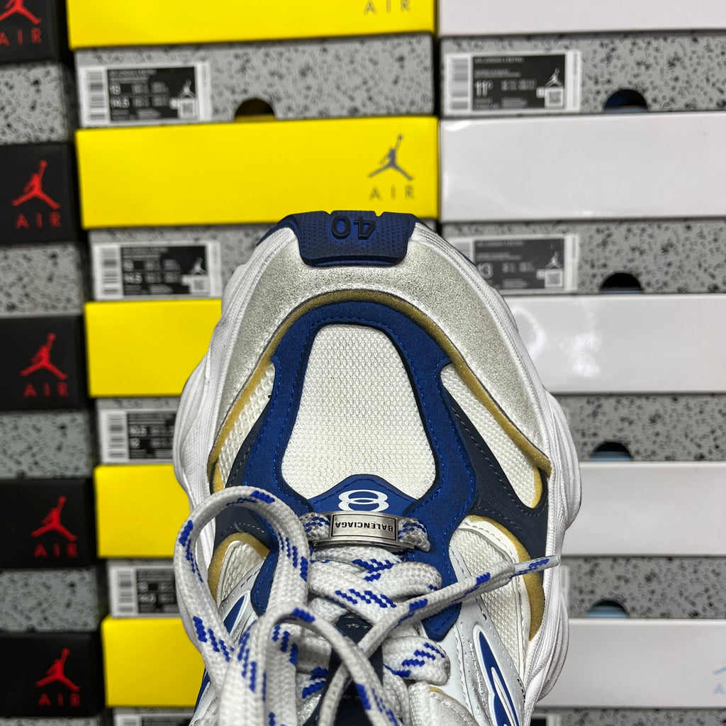 White and blue lace-up sneaker upper with gold trim and mesh toe
