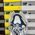 White and blue lace-up sneaker upper with gold trim and mesh toe