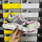 Top view of silver and pink lace-up sneaker with multicolor side accents