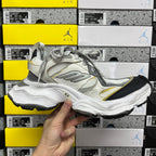 Balenciaga unisex sneakers, opposite side view in white and gray with yellow accent