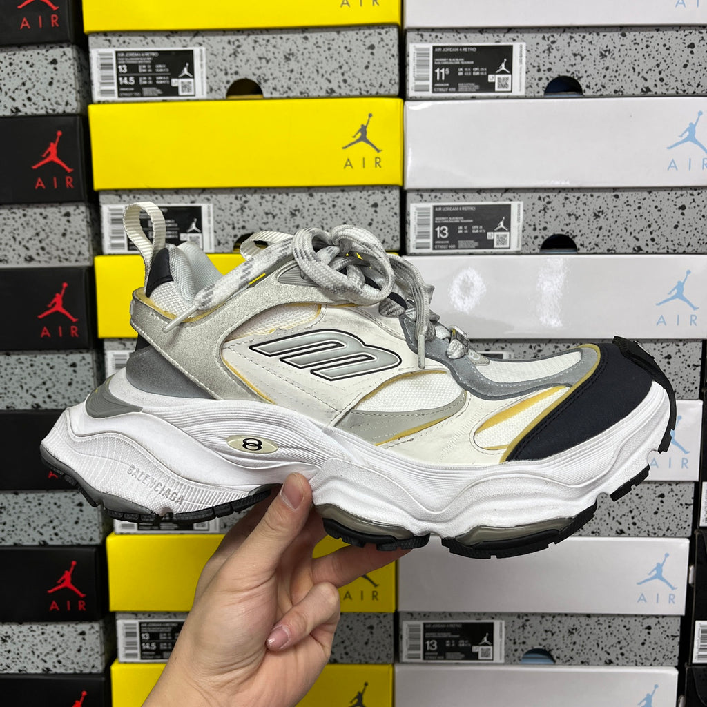 Balenciaga unisex sneakers in white and light gray with yellow accents and black outsole