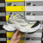 Balenciaga unisex sneakers in white and light gray with yellow accents and black outsole