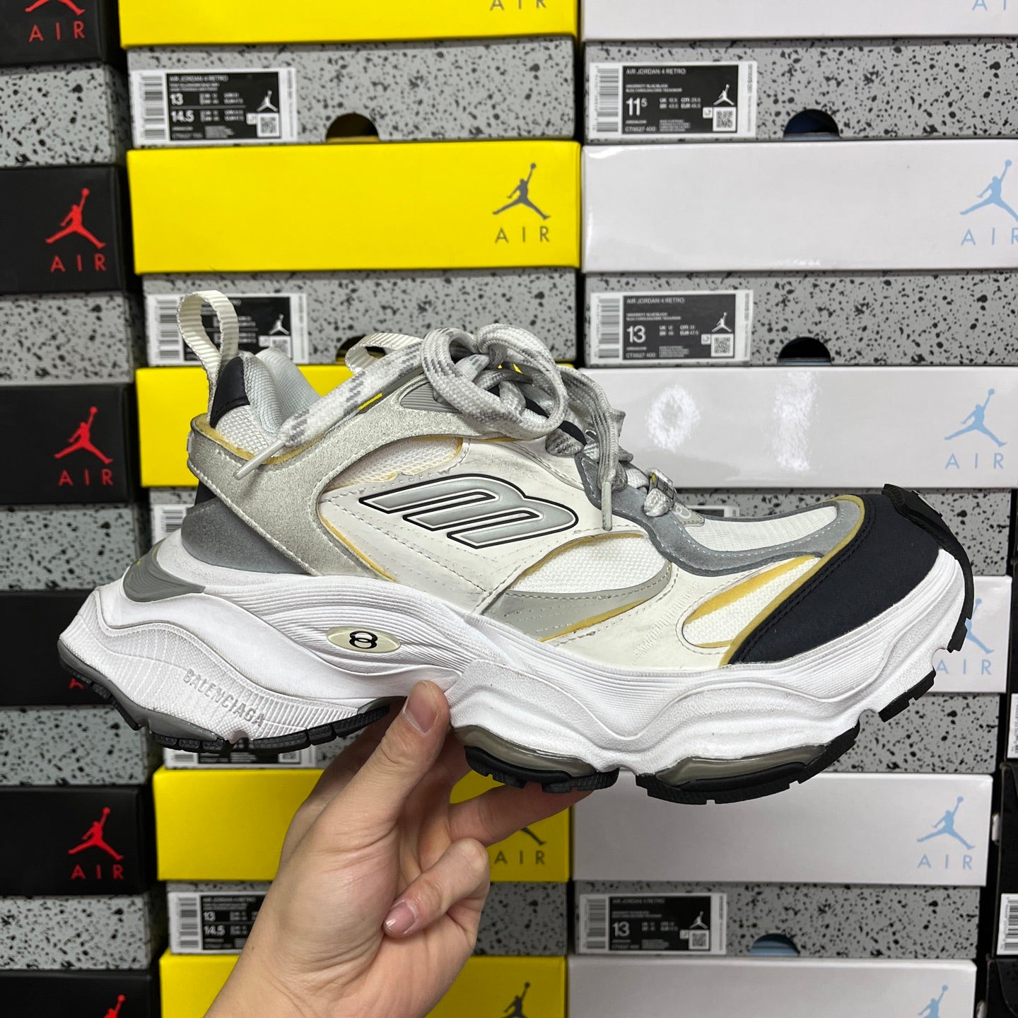 Balenciaga unisex sneakers in white and light gray with yellow accents and black outsole