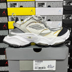 Balenciaga unisex sneakers, side view in white and gray with yellow trim and black sole