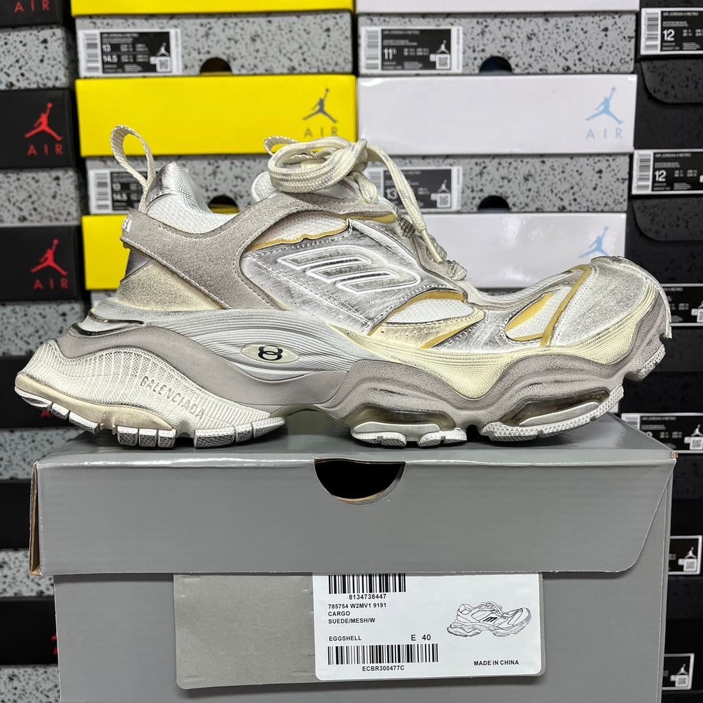 Balenciaga unisex sneakers on box, metallic silver uppers with gold trim