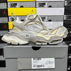Balenciaga unisex sneakers on box, metallic silver uppers with gold trim