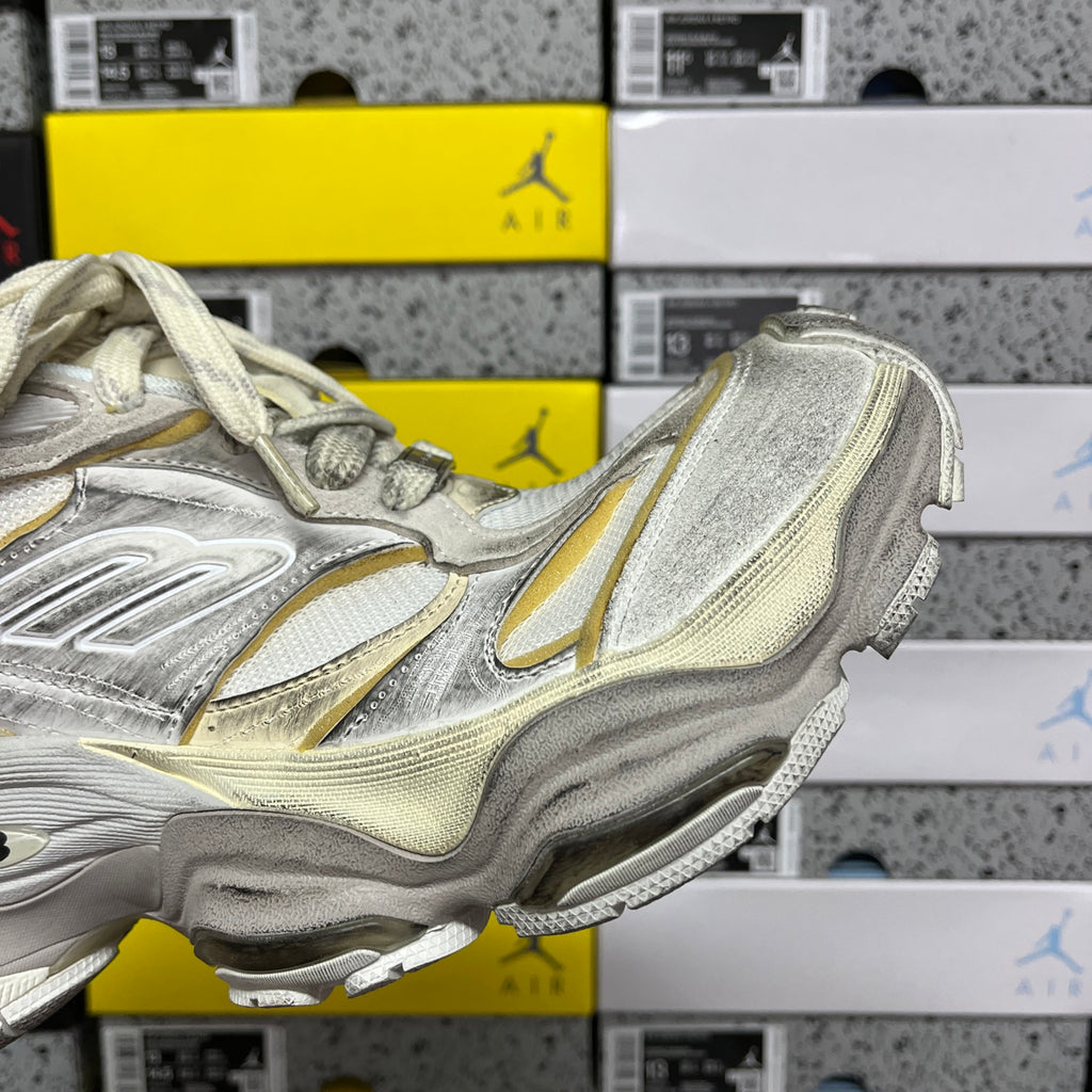 Balenciaga unisex sneakers, metallic silver side profile with gold accent stripe