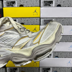 Balenciaga unisex sneakers, metallic silver side profile with gold accent stripe