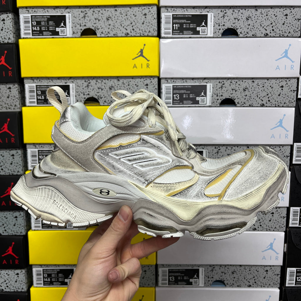 Balenciaga unisex sneakers, metallic silver with gold accents and Air-cushioned sole