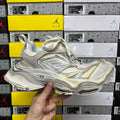 Balenciaga unisex sneakers, metallic silver with gold accents and Air-cushioned sole
