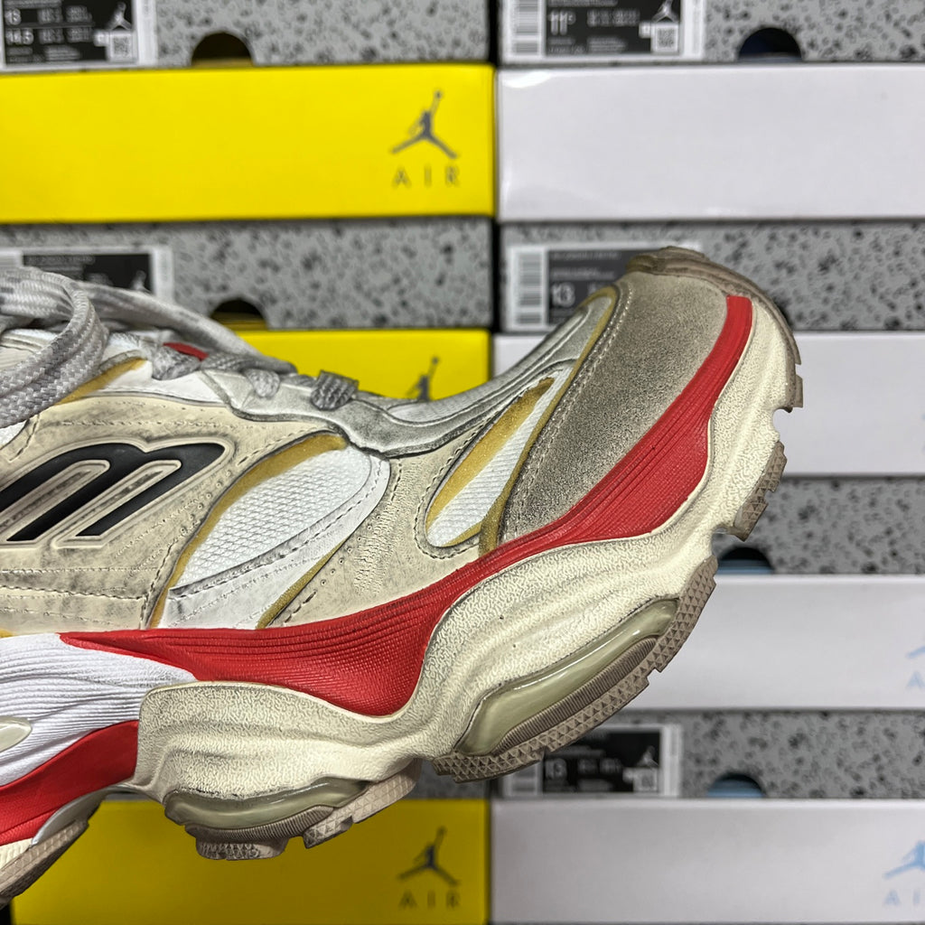 Balenciaga Air sneaker heel side, metallic silver with red stripe and beige sole