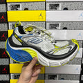 Gray Balenciaga unisex sneaker with blue and neon yellow-green accents, lace-up design