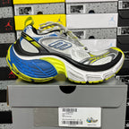 Silver and gray lace-up sneaker with blue and neon yellow outsole and black trim