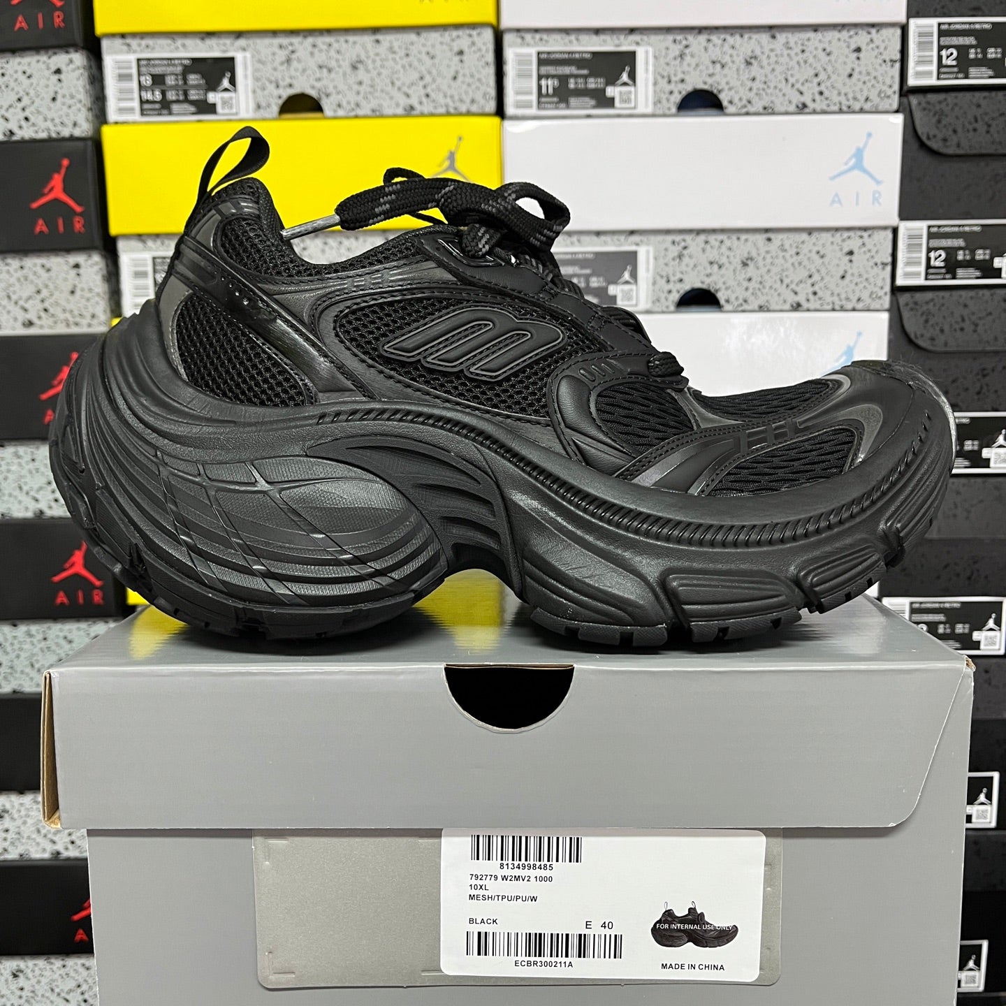 Black chunky Balenciaga unisex sneaker, side view with lace-up mesh upper and thick sole