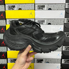 Black Balenciaga unisex sneaker, front-quarter view with lace-up mesh upper and cushioned sole
