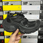 Black chunky Balenciaga unisex sneakers with mesh upper, lace-up front, and molded sole