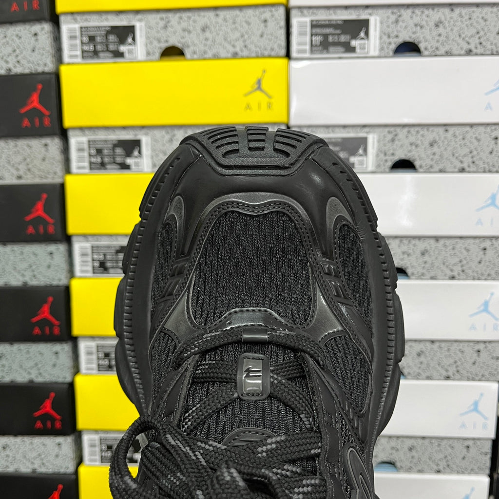 Black Balenciaga unisex sneaker, top view with textured mesh tongue and lace-up closure