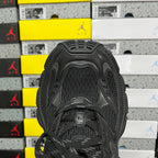 Black Balenciaga unisex sneaker, top view with textured mesh tongue and lace-up closure