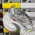 Silver lace-up sneaker with red detailing and neon green accents, thick sole
