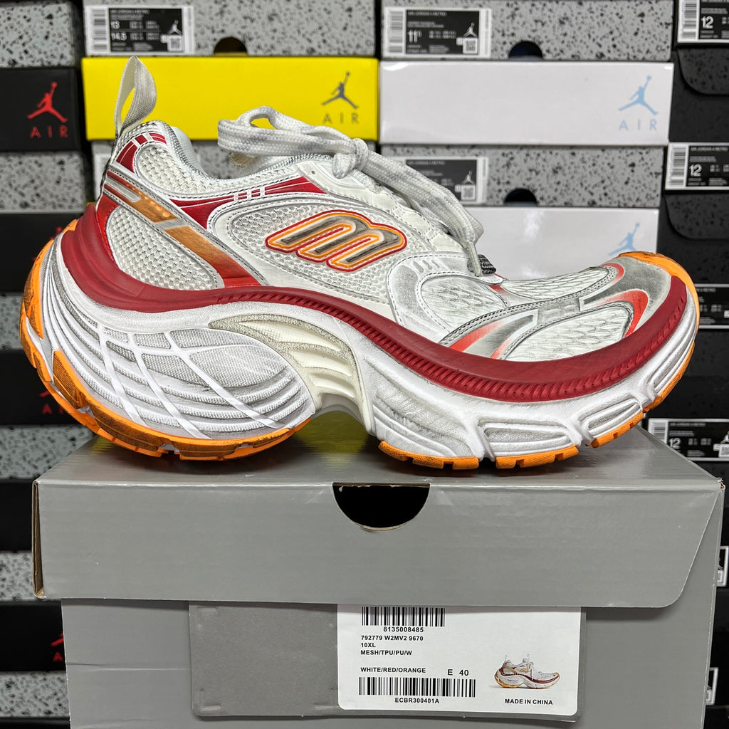 Balenciaga running shoe, white mesh with red and orange accents, chunky outsole