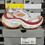 Balenciaga running shoe, white mesh with red and orange accents, chunky outsole