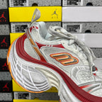 Balenciaga running shoe, white mesh with red stripe and orange logo, chunky outsole