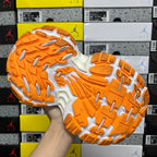 Balenciaga running shoe outsole, orange rubber tread with white cushioning zones