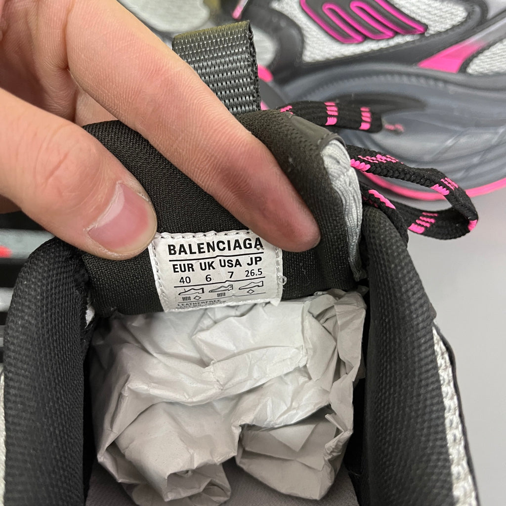 BALENCIAGA size label on inner heel of black mesh running shoe.