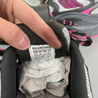 BALENCIAGA size label on inner heel of black mesh running shoe.
