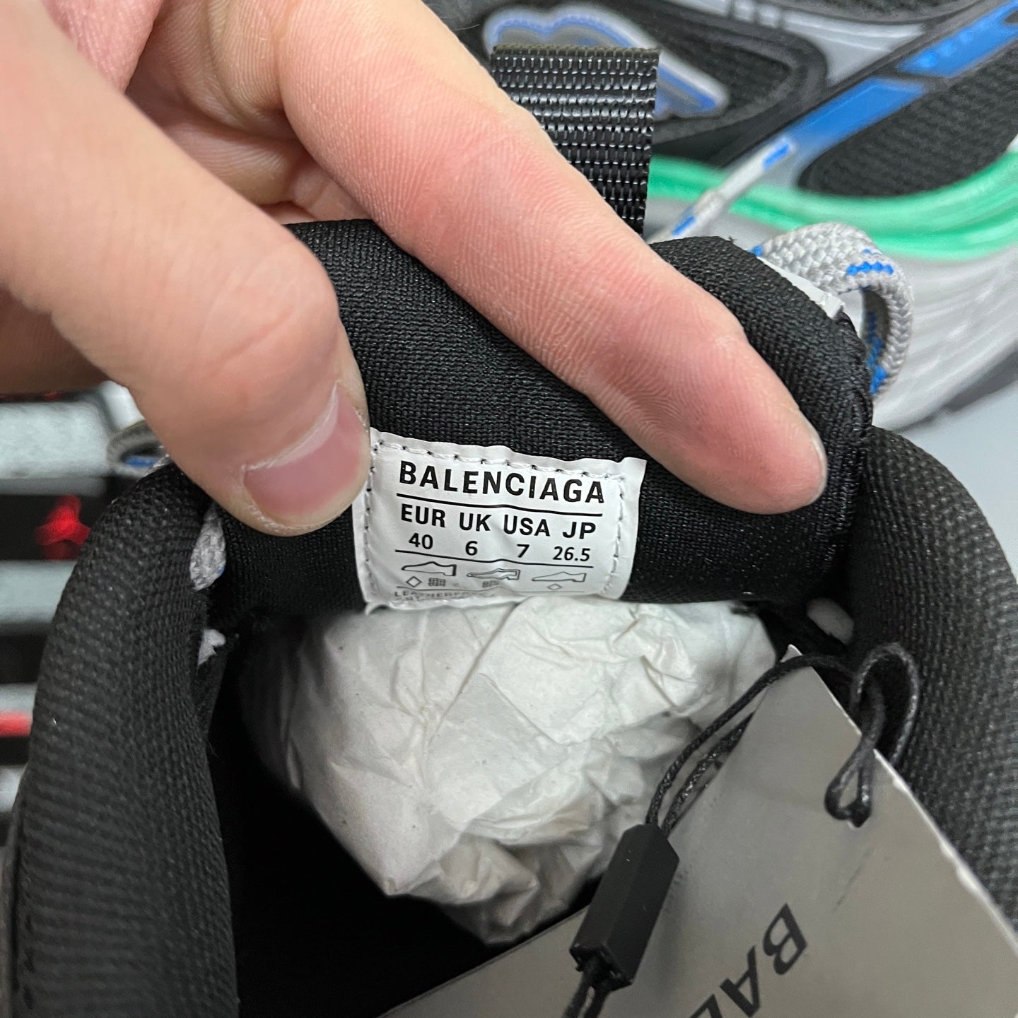 Shoe size label inside black sneaker: BALENCIAGA, EUR/UK/USA/JP sizes