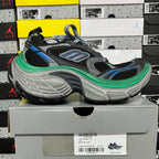 Black lace-up sneaker on gray sole with blue logo details and green edge piping