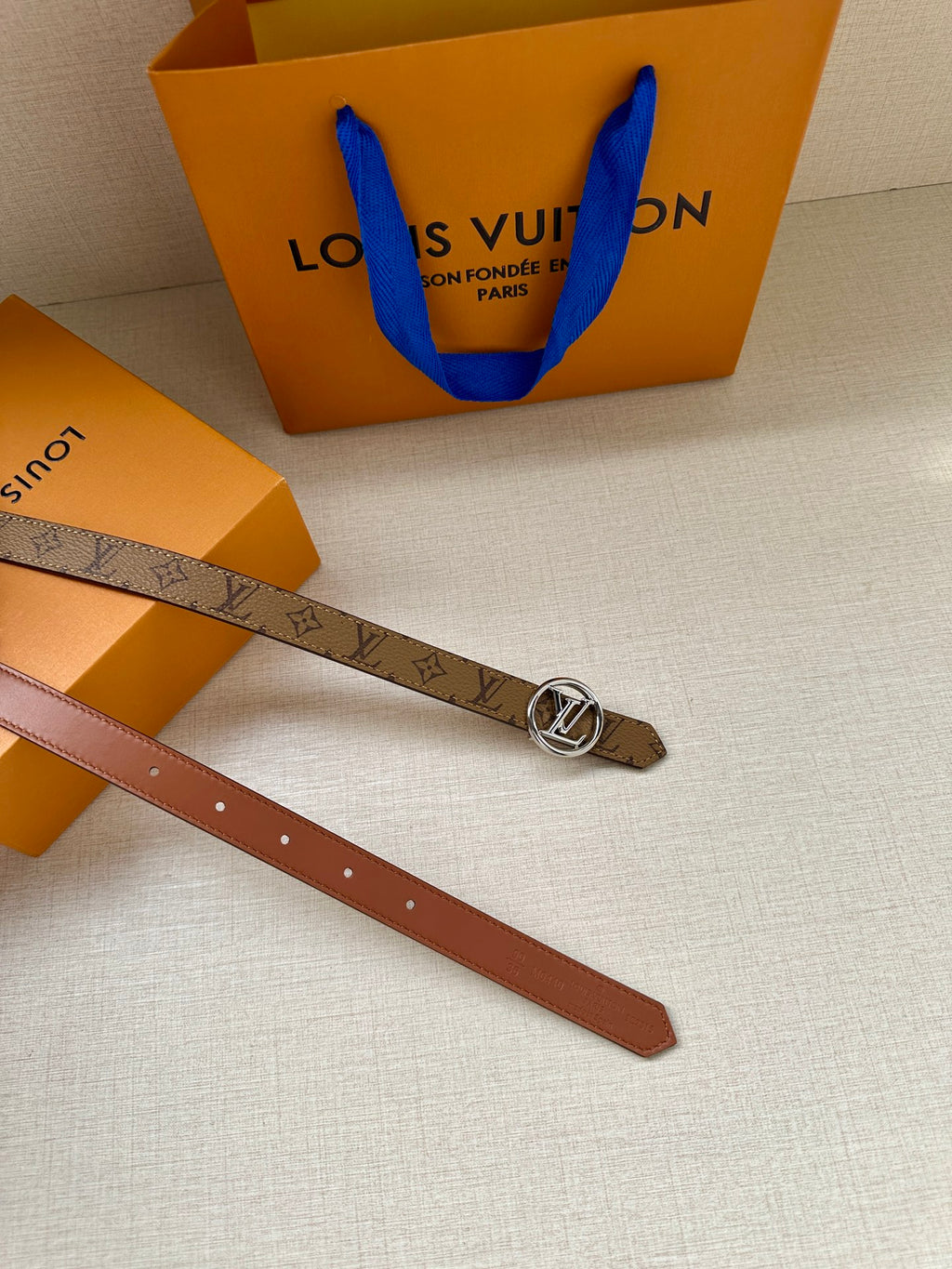 Louis Vuitton monogram belt with gold buckle and brown leather strap
