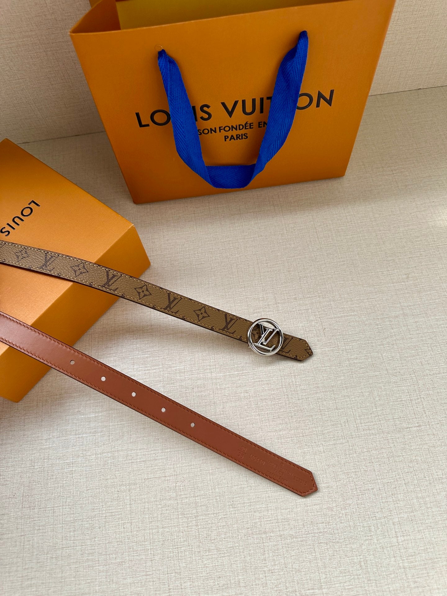 Louis Vuitton monogram belt with gold buckle and brown leather strap