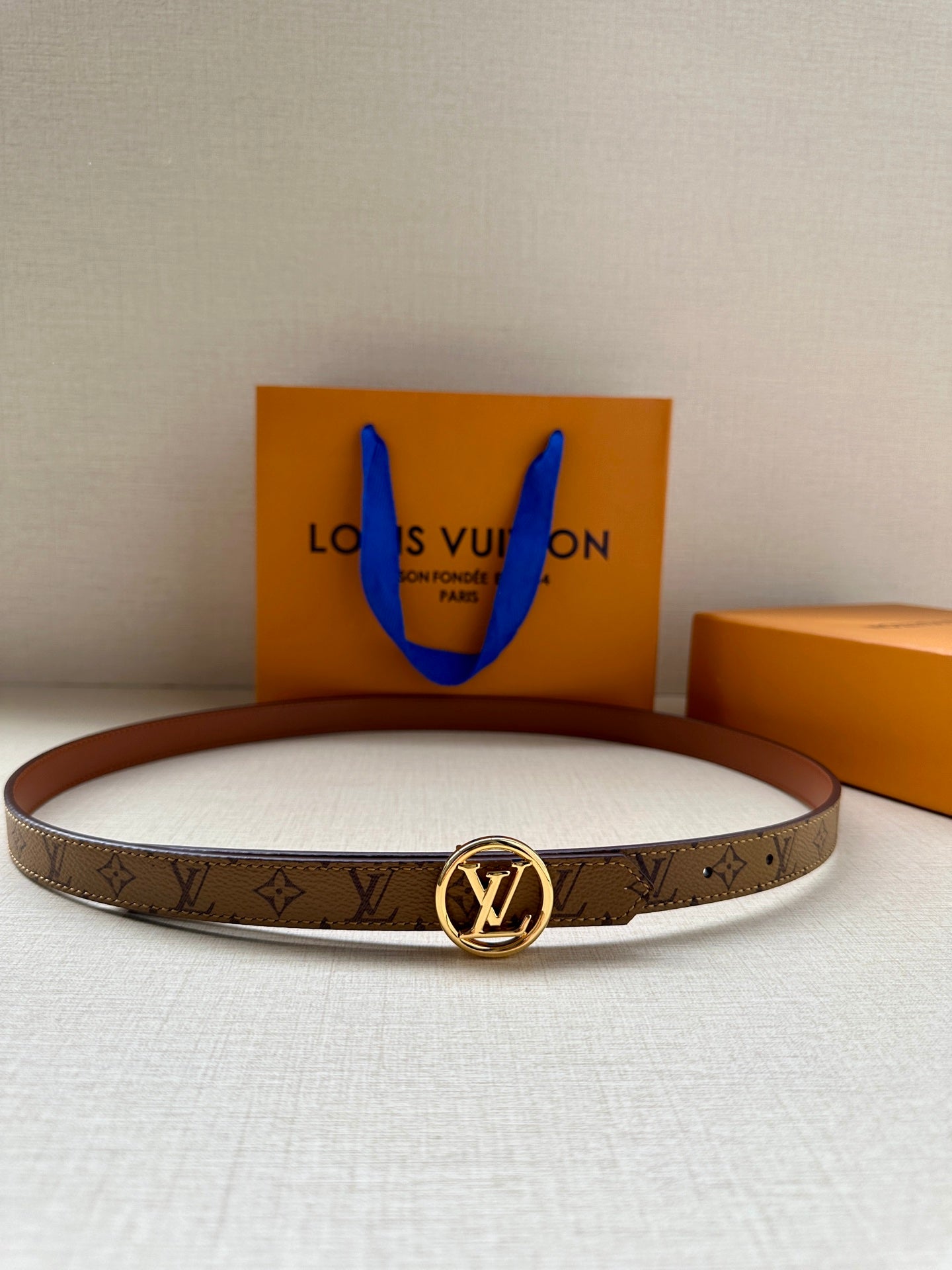 Louis Vuitton monogram belt with gold-tone round buckle on brown strap
