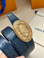 Louis Vuitton belt buckle close-up on dark blue crocodile-texture leather