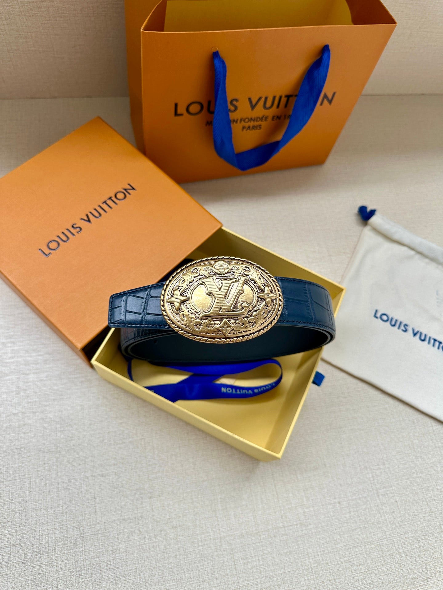 Louis Vuitton dark blue leather belt with gold oval LV logo buckle