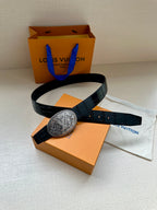 Louis Vuitton belt with dark blue leather and oval silver-tone logo buckle, shown with accessories