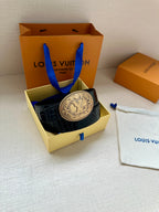 Louis Vuitton belt with dark blue croc-embossed leather and silver-tone oval logo buckle