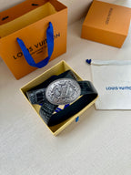 Louis Vuitton belt with dark blue embossed leather and oval silver-tone logo buckle in box