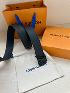 Louis Vuitton leather belt strap and dark buckle detail, with white dust bag