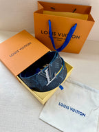 Louis Vuitton belt with navy monogram strap and gold buckle with dust bag