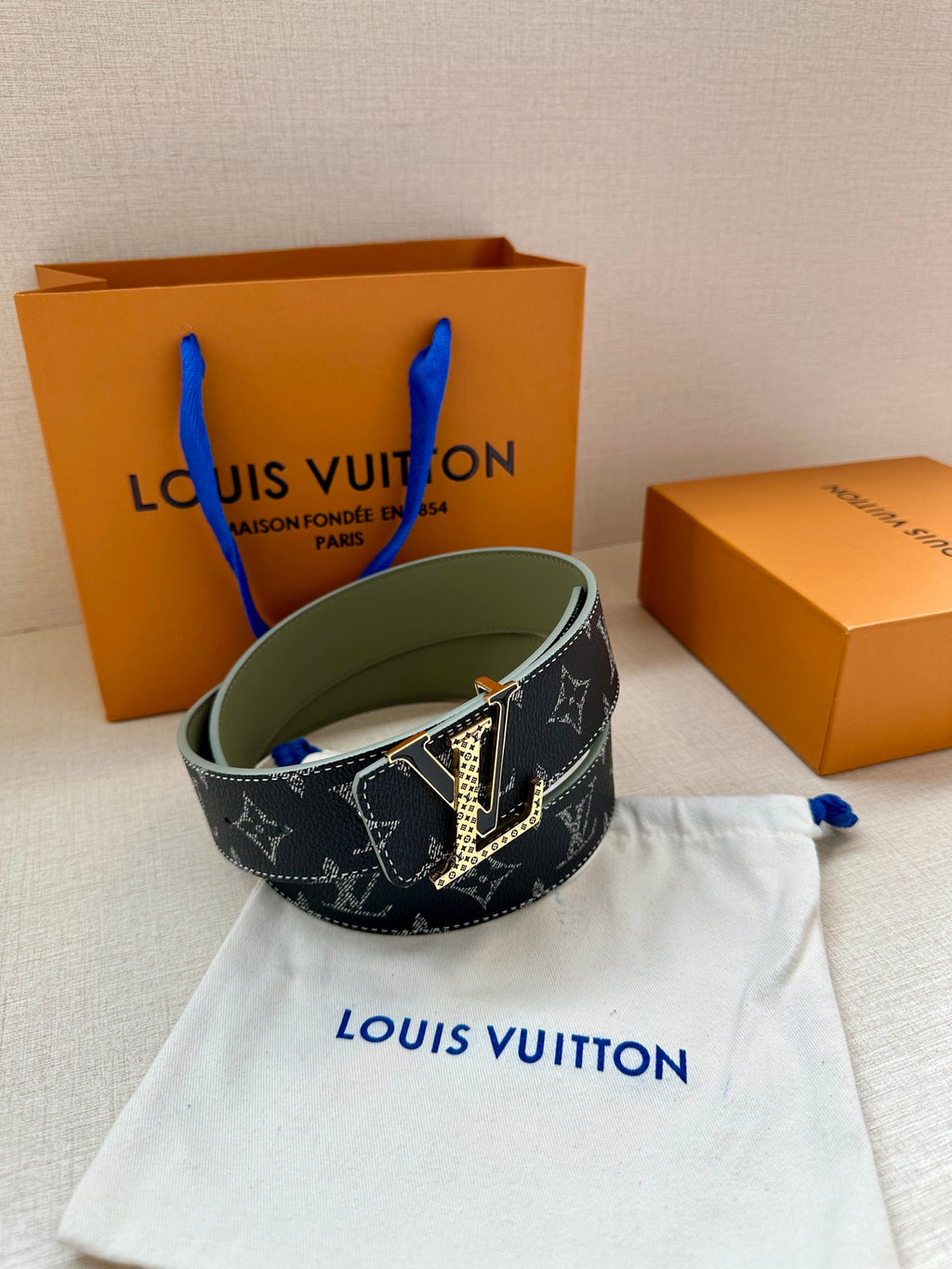 Louis Vuitton monogram belt with dark strap, gold-tone buckle and olive inner leather