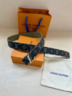 Monogram belt laid on bag, dark strap with repeating LV pattern and gold-tone buckle