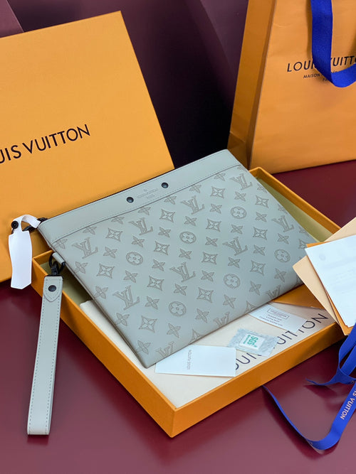 Louis Vuitton small crossbody bag in light blue with embossed monogram pattern