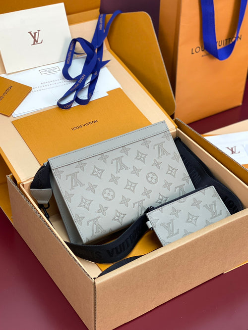 Louis Vuitton small crossbody bag in light blue monogram pattern with dark strap