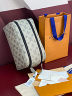 Louis Vuitton monogram toiletry bag, light gray with navy zipper and hanging tag