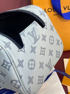 Louis Vuitton monogram toiletry bag side panel with navy zipper detail